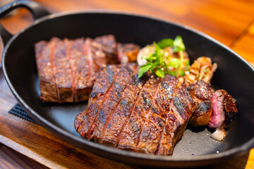 Juicy steak sliced on the plate in restaurant