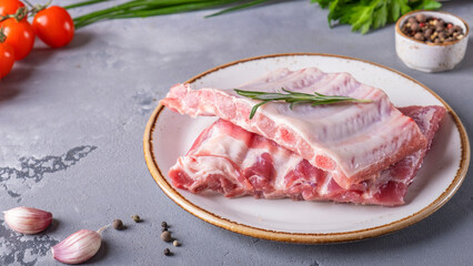 Raw pork ribs on a plate. Preparation food concept. Top view