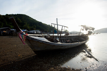 Fototapeta na wymiar Fishing boats in the bay of a fishing village on Ko Yao Island in southern Thailand.