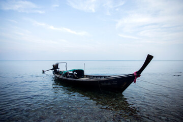 Naklejka premium Fishing boats in the bay of a fishing village on Ko Yao Island in southern Thailand.