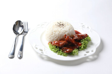 stir fried fresh pork ribs, fish, chicken meat in sweet and sour ketchup tomato sauce with jasmine rice and lettuce on wood tray white background asian chef halal food restaurant banquet cafe menu