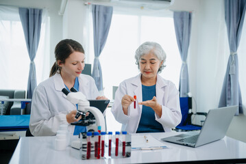 Medical team having a meeting with doctors. Young scientists conducting research investigations in a medical laboratory, a researcher.