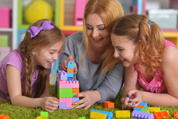 family playing with blocks together