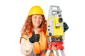 Red hair Woman in yellow hardhat and orange ppe surveyor working with modern surveying geodesic instrument tacho meter checking coordinates.  Young woman working in construction industry concept