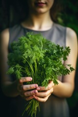 cropped shot of an unrecognizable young woman holding herbs and vegetables