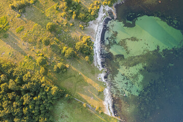 Aerial view of maritime sea landscape, seascape. Wild nature and water. Stones, grass and water. Untouched nature. National nature reserve, national park.