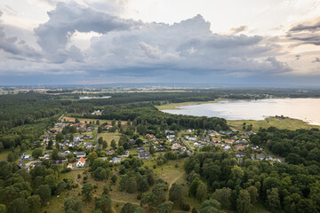 Obraz premium Aerial view of little village by the sea, a lot of private houses by the sea, seaside village, resort town