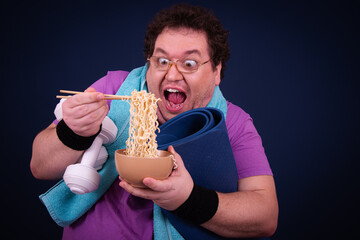 Funny fat man eats Chinese noodles. Diet and healthy lifestyle.