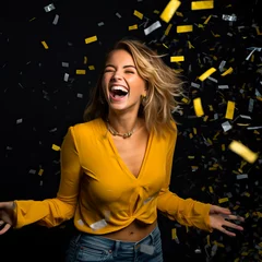 Fotobehang Woman laughing or smiling with confetti in the air, looking happy. Concept of Black Friday, Cyber Monday, sales and discounts. Black studio background and copy space. © henjon