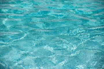 Pool water background, blue wave abstract or rippled water texture background.