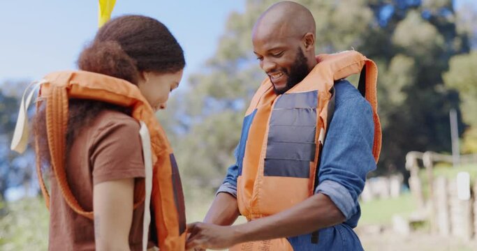 Kayak, lifejacket and couple high five by lake for rowing on holiday, vacation and adventure in nature. Water sports, travel and man and woman excited for motivation, canoeing and paddle boating