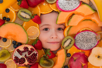 Top view of kids face with different fruits. Summer fruits. Kids face with mix of fruits. Assorted fruits.