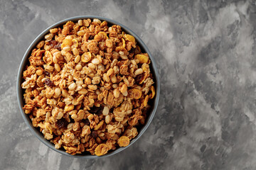 Wholesome Granola Bowl on Gray Concrete, Top View, Copy Space