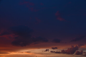 Pink clouds and evening sunset sky after a thunderstorm. Blue-red sunset evening. Beautiful pink clouds.