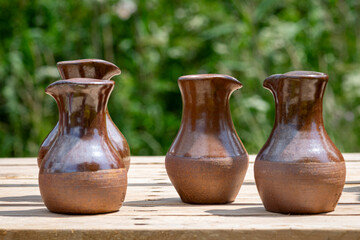 Four handmade clay jugs