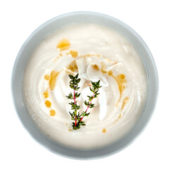 Cauliflower puree soup with coconut milk on a white background