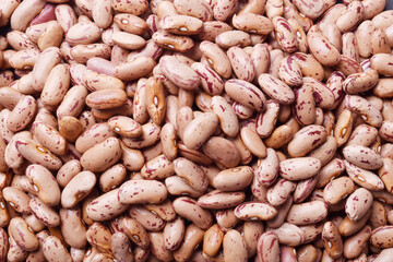 Top view of raw pinto beans texture background