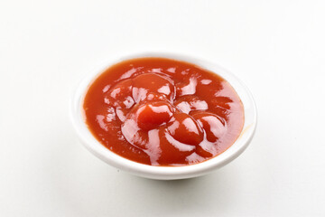 Closeup of tomato ketchup on white background