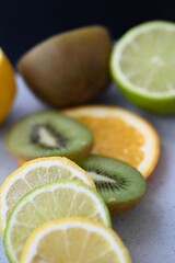 sweet and sour citrus fruits in rose on the background 