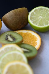  sweet and sour citrus fruits in rose on the background 