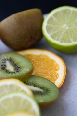 sweet and sour citrus fruits in rose on the background 