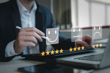 customer service evaluation and feedback rating. costumer review concept, man using phone chooses happy smiling face