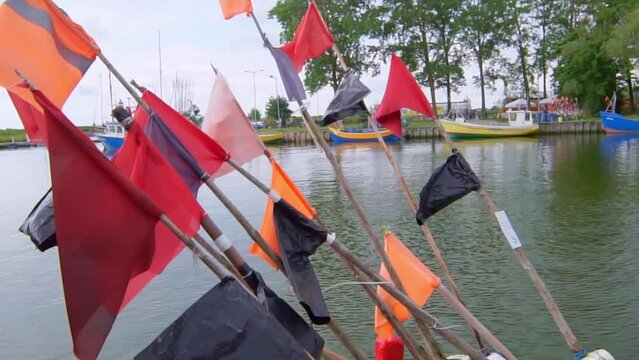 Fishing boat with trap flags in Rybacka harbor on the Curonian Lagoon in Poland