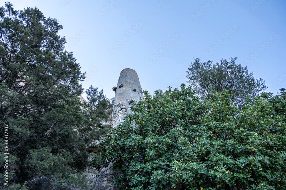 Wall mural old stone mill in the mountains of Crete on a sunny day