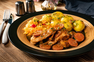 Stewed turkey meat with chorizo sausage.