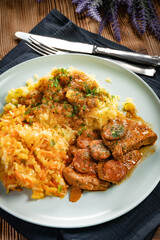 Stewed turkey meat with chorizo sausage.