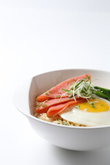 cook Japanese instant noodle mee soup with chicken ham, fried egg and vegetables on bowl chopstick on white vintage newspaper background asian chef halal food restaurant banquet menu