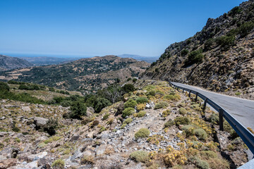 Panoramic view of the mountains of the Gorge and the Sea against the backdrop of the blue sky on the island of Crete Sunny Day