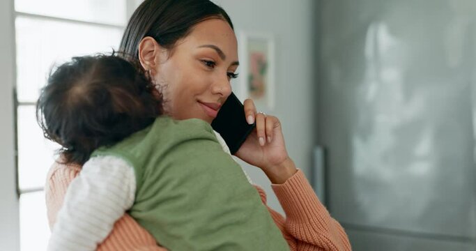 Phone call, multitask and a woman holding her baby in the living room of her home for communication or networking. Mobile, talking and a young single mother with her infant child in the kitchen