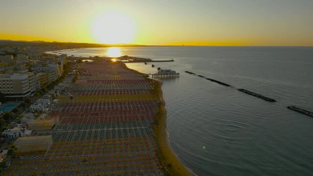 Italy, August 2023: aerial sea view of the sunset on the Romagna Riviera from Gabicce, Cattolica, Misano, Riccione to Rimini