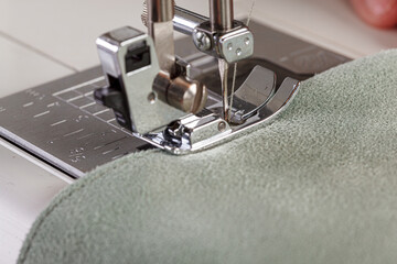 Sewing machine, stitching fabrics, needle in a round plan