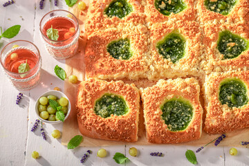Homemade gooseberry yeast cake made of berry fruits.