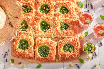 Sweet gooseberry yeast cake served with red tea.