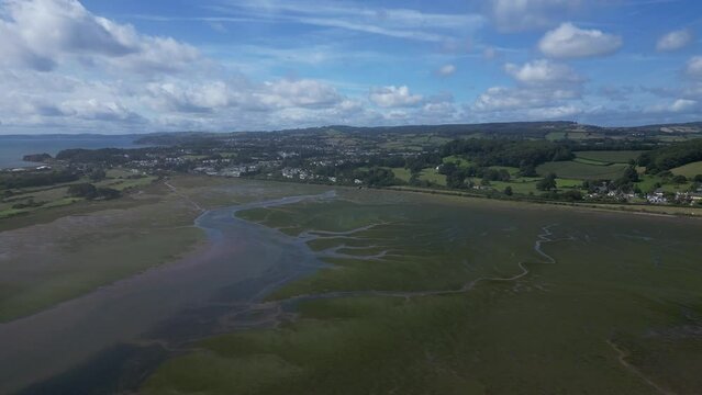 River Exe, South Devon, England: DRONE VIEWS: The drone flies towards Shutterton Creek and the mainland. The River Exe is a popular UK holiday destination area (Clip 2).