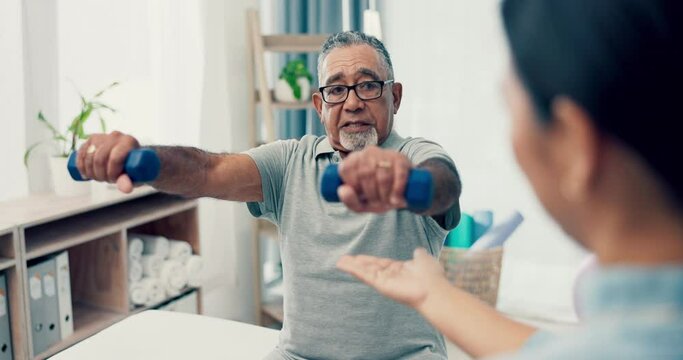Senior care, help and physiotherapist with old man, dumbbell and healthcare at nursing home. Physio, exercise and retirement, fitness coach caregiver and elderly patient mobility training in clinic.