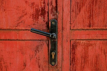 Lock with handle on a metal door of a house