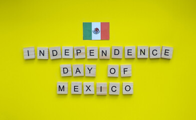September 16, Independence Day of Mexico, flag of Mexico, minimalistic banner with the inscription in wooden letters on a yellow background
