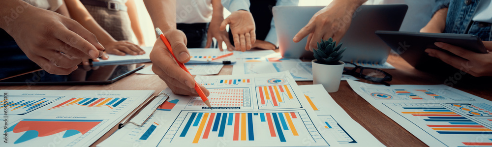 Leinwandbilder focus panorama shot of chart and graph paper with blur analyst team utilize bi fintech to analyze fi