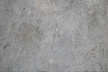 Smooth surface gray cement background, old and pale with some scratch concrete background.