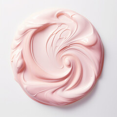 a drop of pink cream on a white background