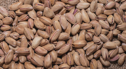 Pistachios on burlap sack. Healthy food high protein. Dietary nutrition. close-up