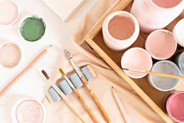 Set of painting brushes and colors for artists. Craft artistic background. Recomforting, destressing creative hobby, art therapy