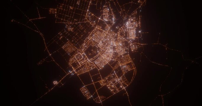 Tabuk (Saudi Arabia) aerial view at night. Top view on modern city with street lights. Camera is zooming out, rotating counterclockwise. Vertical video. The north is on the left side