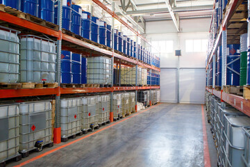 Warehouse of chemical products. Racks with cisterns. Interior of warehouse of petroleum products....