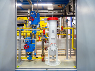 Interior chemical factory. Industrial pipes. Basement in industrial enterprise. Manometers and valves on pipes. Chemical factory. Manufactory interior. Engineering communications chemical plant