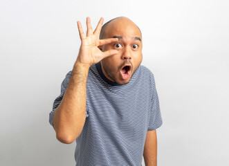 Shocked face. Happy Young asian man on isolated white background. Handsome middle aged Indian man